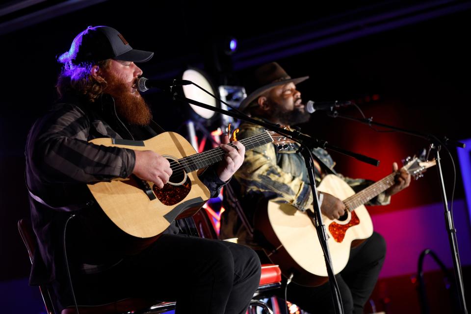 Musical artists Leo Brooks (R) and Andrew Millsaps of Neon Union perform prior to the Jimmie Allen PBA Challenge presented by Bowlero at Bowlero Matthews on October 05, 2022 in Matthews, North Carolina. (Photo by Jared C. Tilton/Getty Images for PBABowleroCorp )