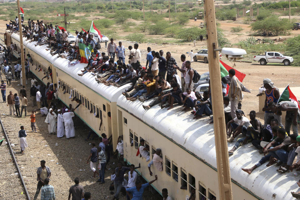 Sudanese pro-democracy supporters celebrate a final power-sharing agreement with the ruling military council Saturday, Aug 17, 2019, in the capital, Khartoum. The deal paves the way for a transition to civilian-led government following the overthrow of President Omar al-Bashir in April. (AP Photo)