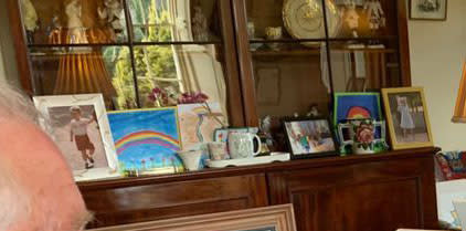 A picture which looks to be of Prince George is on his sideboard. (Clarence House/Global)