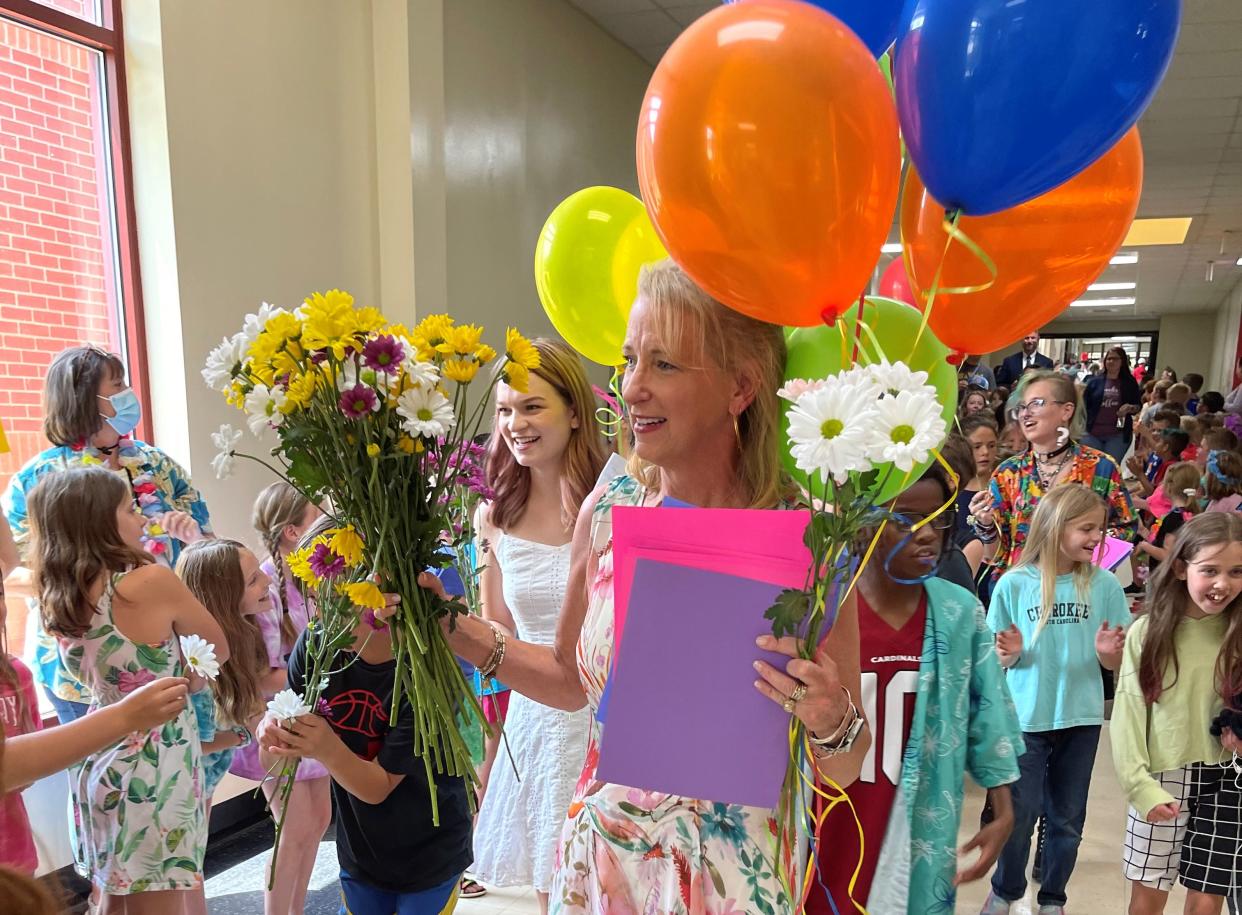 Glenn C. Marlow Elementary School fourth grade teacher Karen Whiting is congratulated by students after she was named the Henderson County Teacher of the Year.