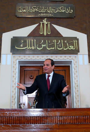 FILE PHOTO - Egyptian President Abdel Fattah al-Sisi greets members of the Supreme Judiciary Council before his speech during the celebration of 'judicial day' at the main headquarters of the Supreme Court in Cairo, Egypt April 23, 2016 in this handout picture courtesy of the Egyptian Presidency. The Egyptian Presidency/Handout via REUTERS/File Photo