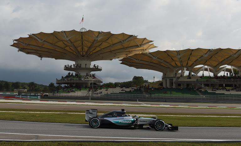 Mercedes AMG Petronas driver Lewis Hamilton takes pole position in the qualifying session at the Formula One Malaysian Grand Prix in Sepang on March 28, 2015