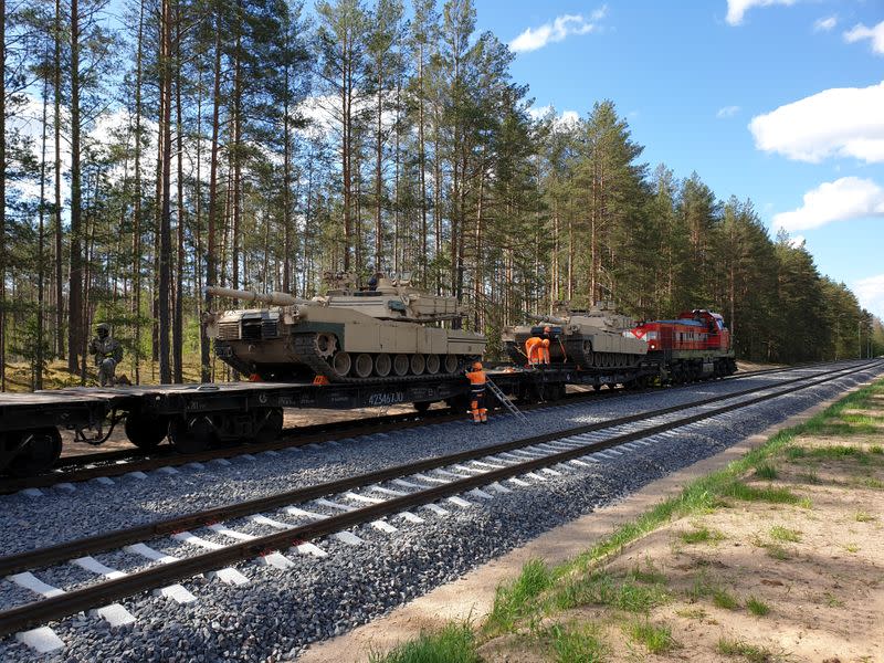 U.S. Abrams tanks are loaded on rail in Pabrade training ground