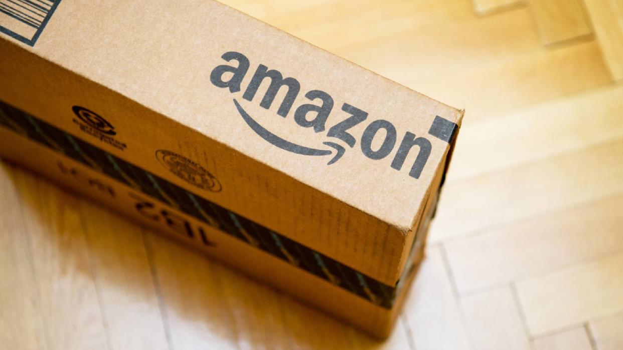  Cardboard box with Amazon logo. 