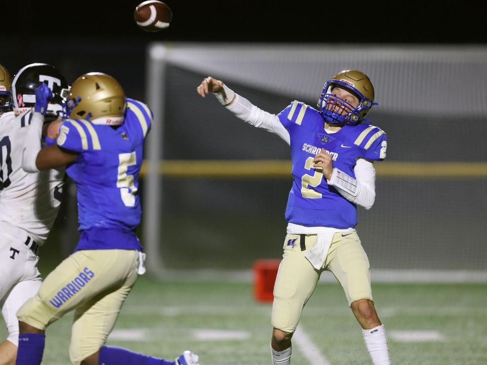 Schroeder quarterback Drew Hilfiker makes an off balance throw.