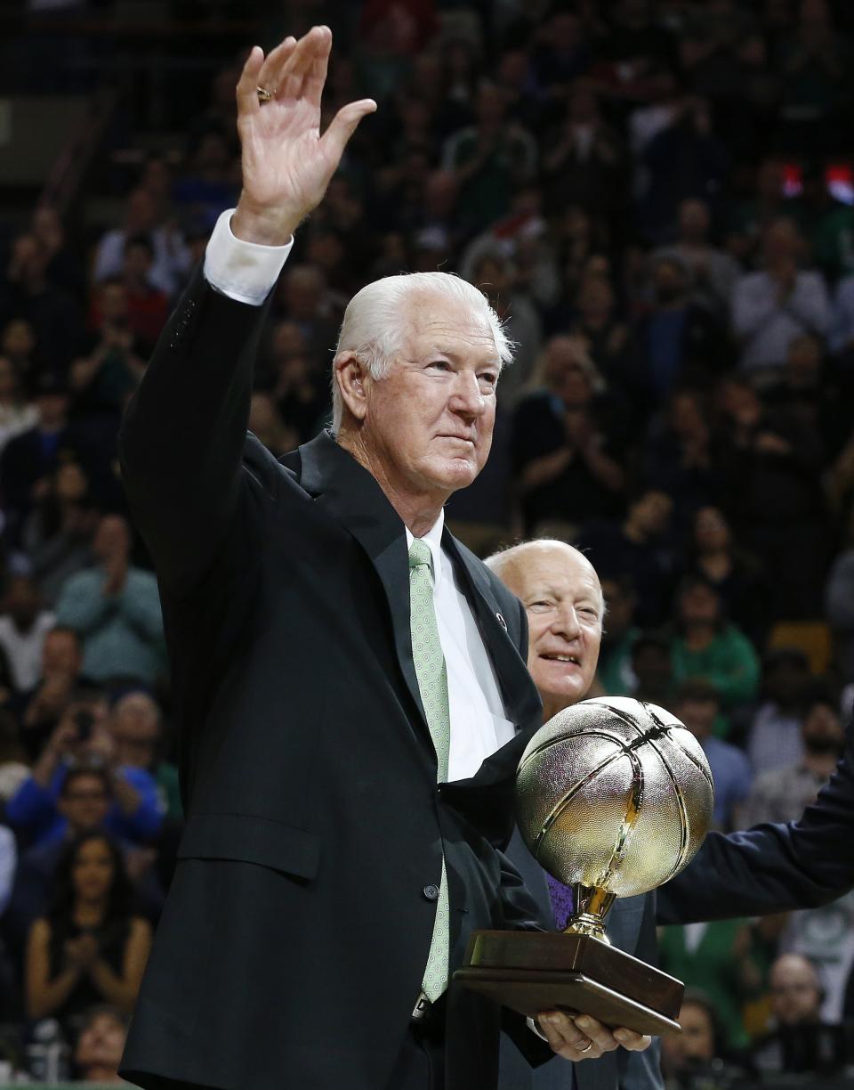 FILE - In this Tuesday, April 14, 2015 file photo, former Boston Celtics great John Havlicek waves while being honored on the court after the first quarter of an NBA basketball game against the Toronto Raptors in Boston. The Boston Celtics say Hall of Famer John Havlicek, whose steal of Hal Green’s inbounds pass in the final seconds of the 1965 Eastern Conference finals against the Philadelphia 76ers remains one of the most famous plays in NBA history, has died. The team says Havlicek died Thursday, April 25, 2019 at age 79. (AP Photo/Michael Dwyer, File)