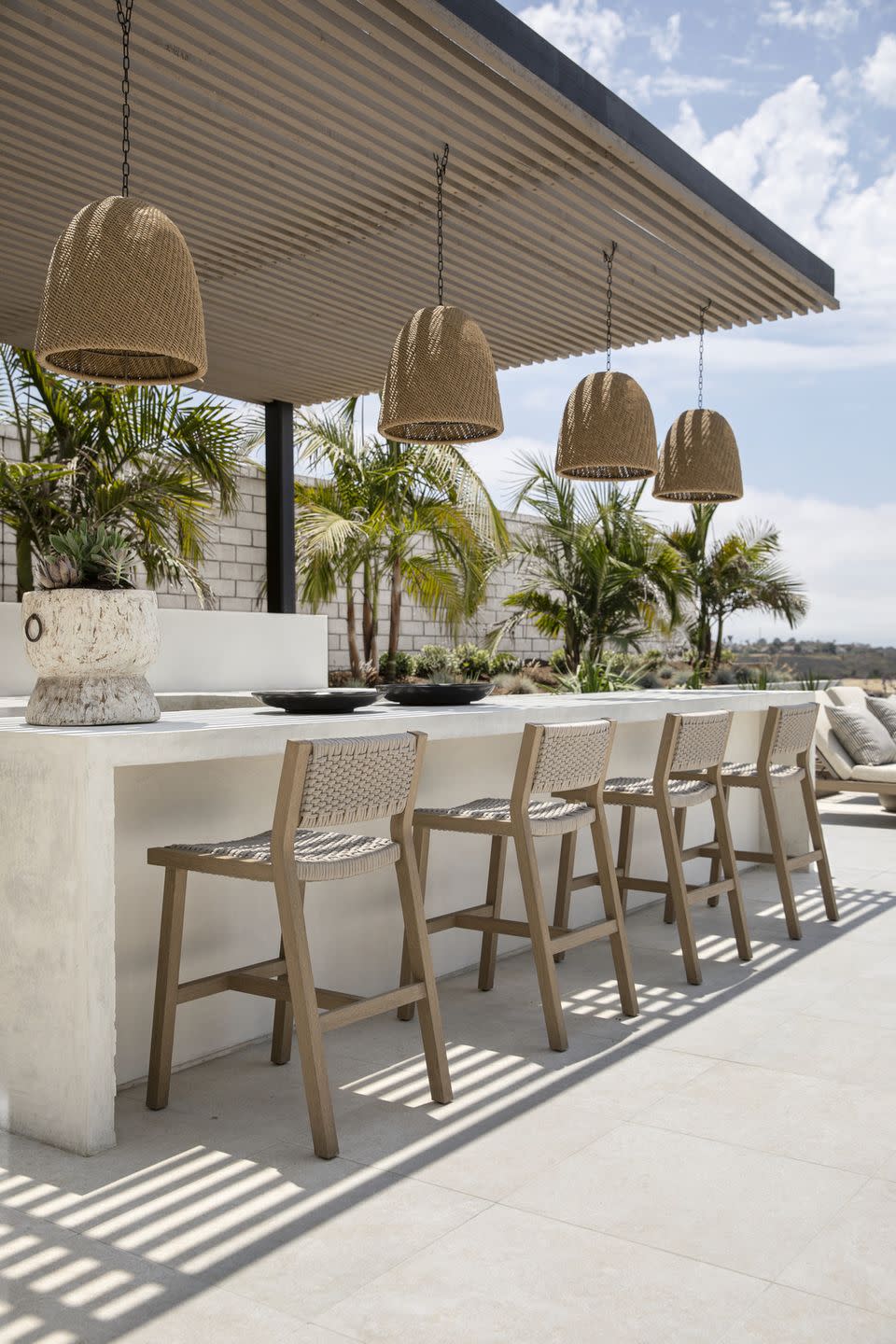 a table with chairs and a table with a lamp on it