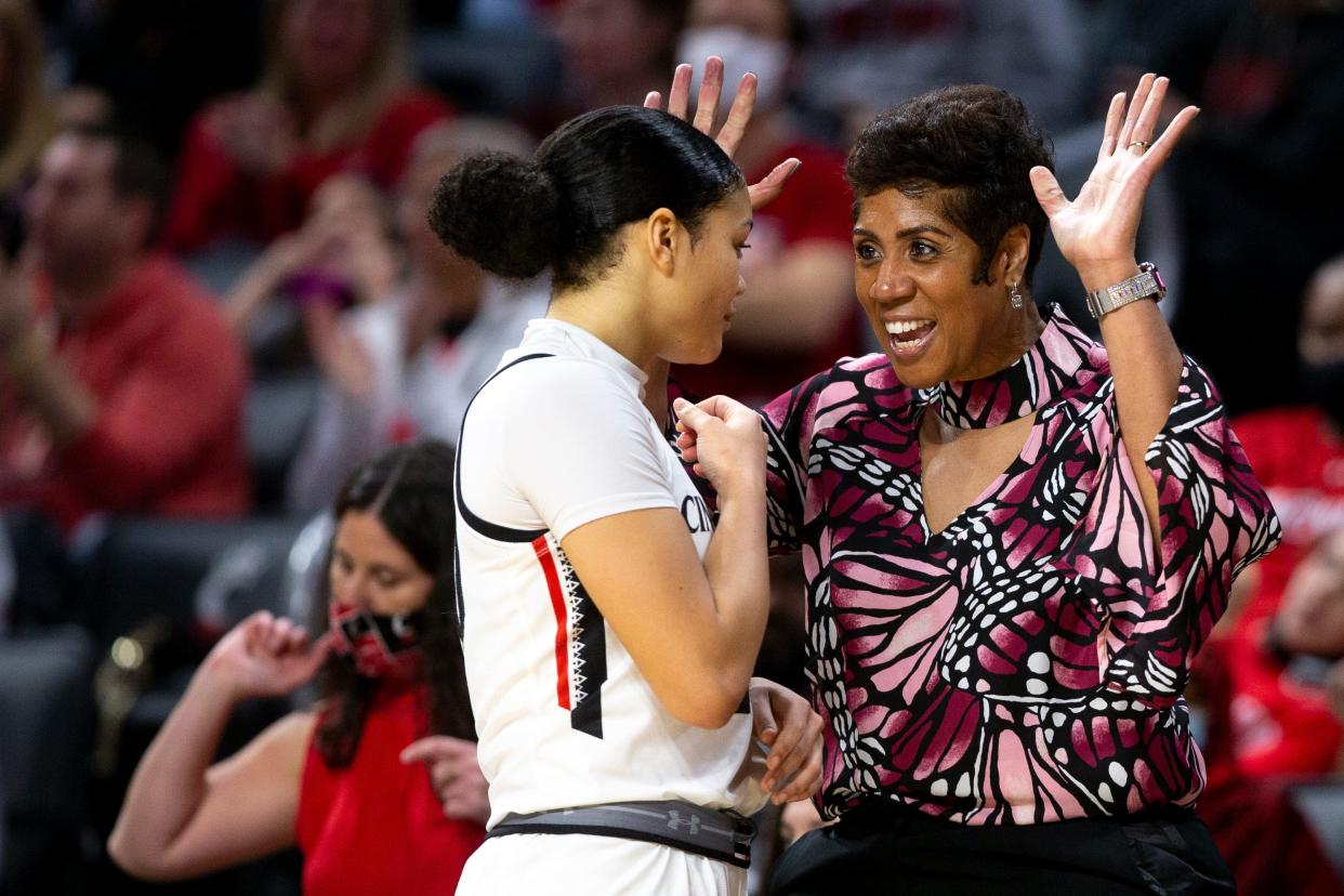 Cincinnati women's basketball coach Michelle Clark-Heard (right) and preseason second-team All-AAC selection Jillian Hayes will lead the Bearcats against Louisville in the season opener Monday night.