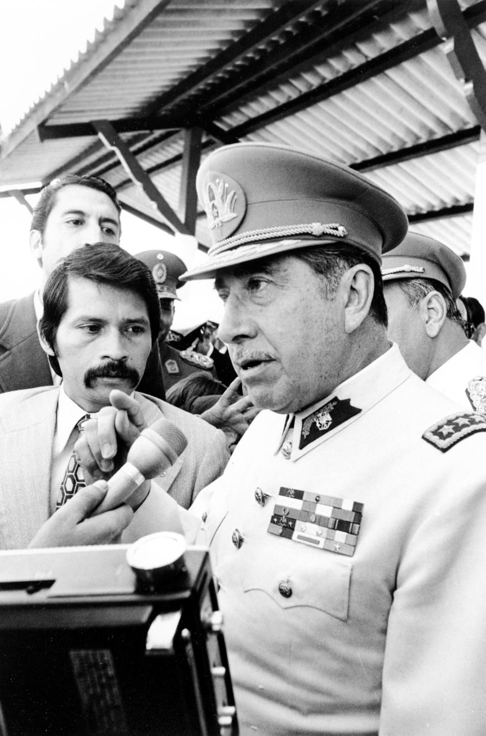 President of the Chilean military junta Augusto Pinochet gestures during a news conference at the Guarani Hotel in Asuncion, Paraguay on May 15, 1974.  (AP Photo/Di Baia)