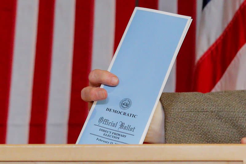 A ballot is inserted in to the ballot box shortly after midnight in the U.S. Democratic presidential primary at the Hale House at Balsams Hotel in Dixville Notch