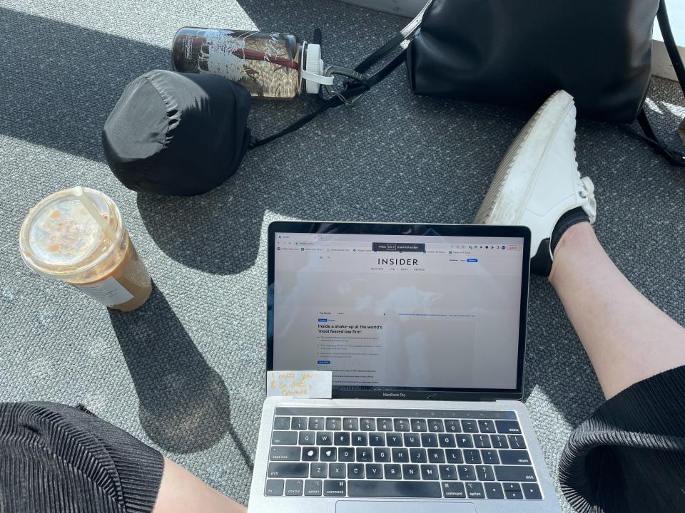 Insider's author sat on the floor at her gate waiting to board her economy flight.