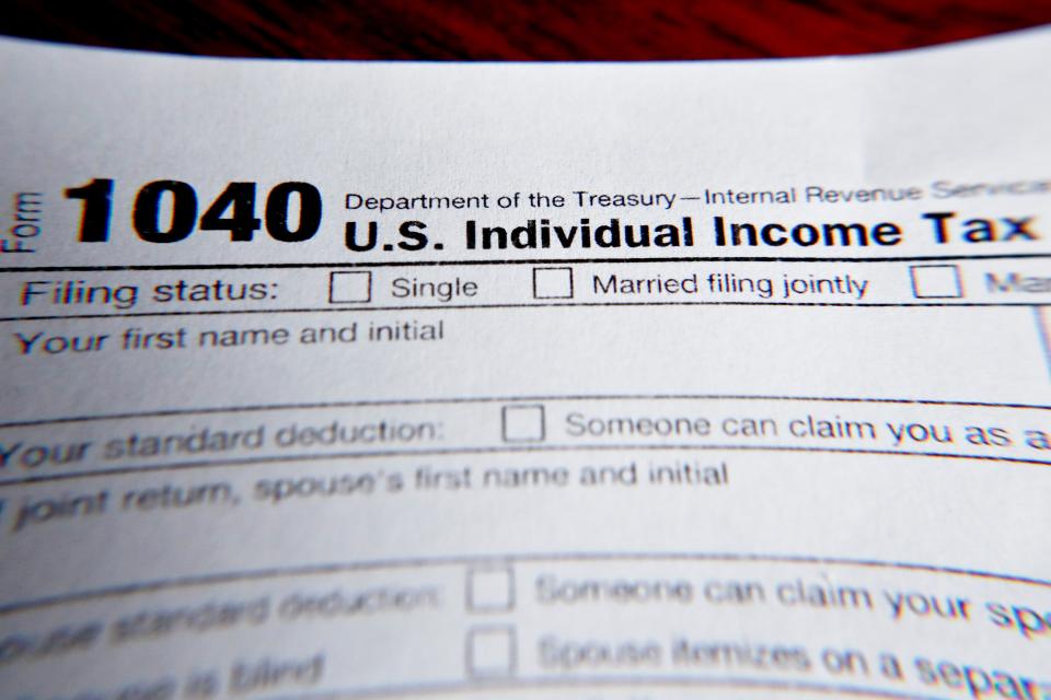 As of Dec. 4, 2021, the IRS said it has a backlog of 6.7 million unprocessed individual returns and 2.6 million unprocessed amended individual returns. Taxpayers who filed 2020 returns by paper and the regular mail now say the IRS wants them to send copies of their returns, even though the check was already cashed a year ago. FILE - This 2019 photo shows part of a 1040 federal tax form printed from the Internal Revenue Service website, in Zelienople, Pa. (AP Photo/Keith Srakocic, File)