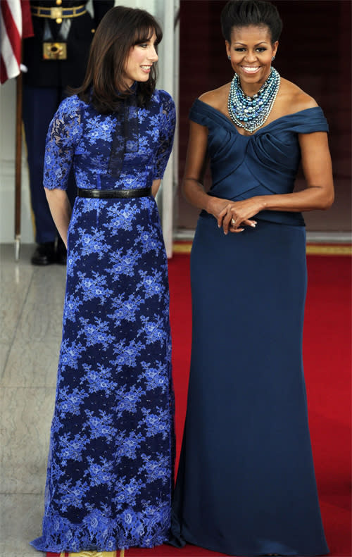 <b>Dinner at the White House, March 2012</b><br><br>At a dinner thrown by the Obamas, Michelle matched Samantha Cameron with in floorlength blue. Michelle's teal off-the-shoulder Marchesa gown was designed by Georgina Chapman, set off with a Tom Binns necklace.