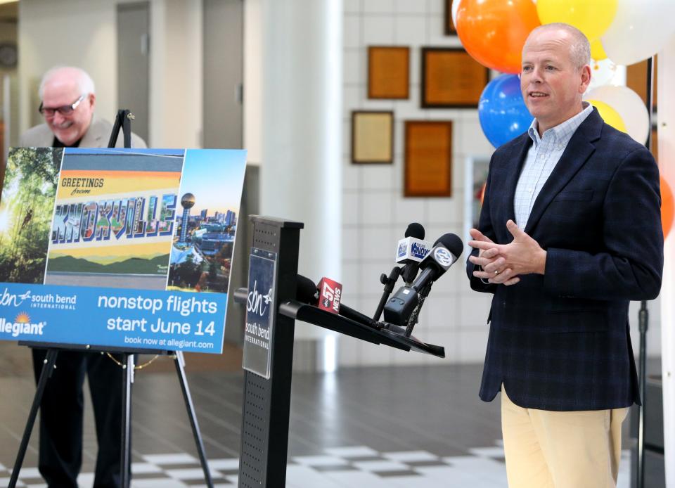 Jeff Rea, right, president and CEO of the South Bend Regional Chamber of Commerce, speaks Monday, Feb. 12, 2024, at South Bend International Airport for the announcement that Allegiant Airlines will offer South Bend flights to and from Knoxville, Tenn., starting June 14.