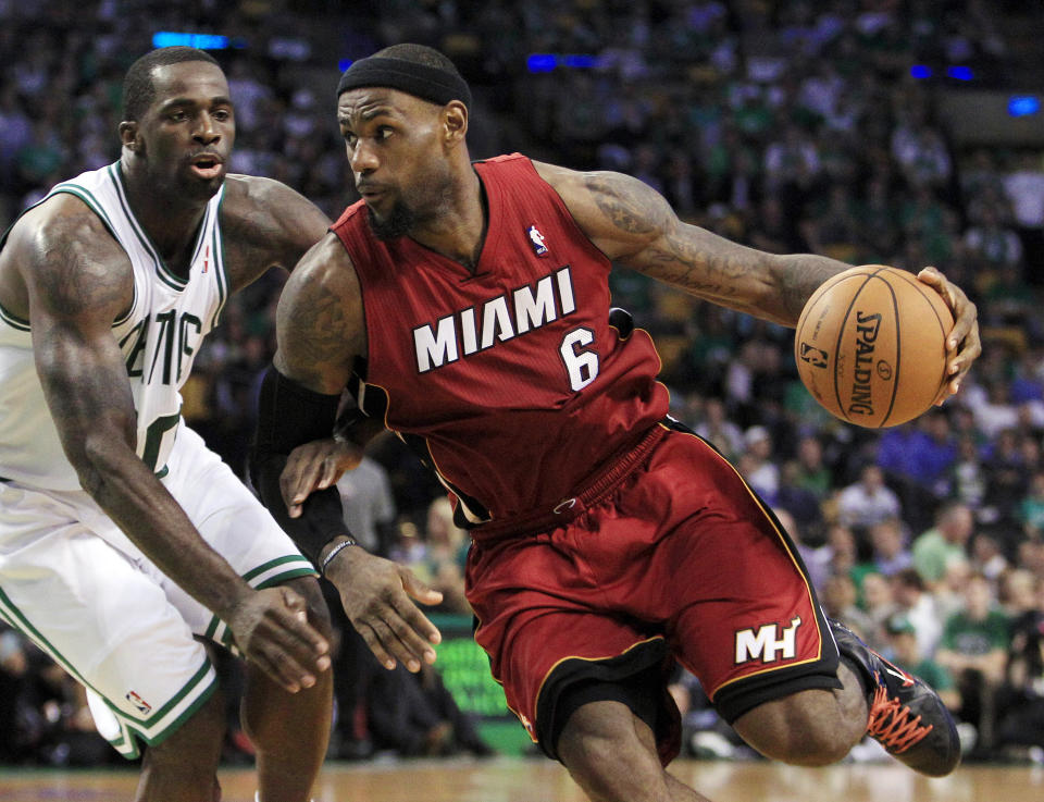 FILE -Miami Heat forward LeBron James (6) drives against Boston Celtics forward Brandon Bass (30) during the third quarter in Game 6 of the NBA basketball Eastern Conference finals, Thursday, June 7, 2012, in Boston. LeBron James is about to pass Kareem Abdul-Jabbar as the NBA's career scoring leader. The AP is looking back at some of his top games along the way.(AP Photo/Elise Amendola, File)