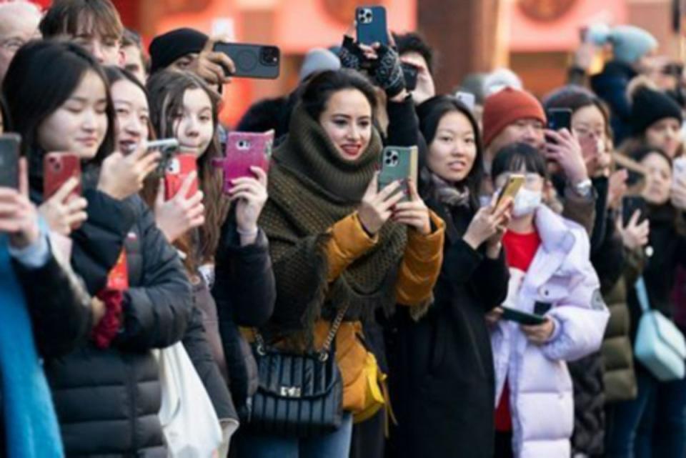 Chinese new year 2.jpg: Spectators watch the parade in London (PA)