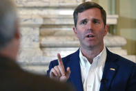 Kentucky Governor Andy Beshear answers questions during an interview with The Associated Press at the Kentucky State Capitol in Frankfort, Ky., Wednesday, Dec. 7, 2022. (AP Photo/Timothy D. Easley)