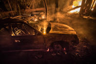 <p>A car burns on Wednesday in Kenwood, Calif, on Oct. 11, 2017. (Photo: Paul Kuroda via ZUMA Wire) </p>