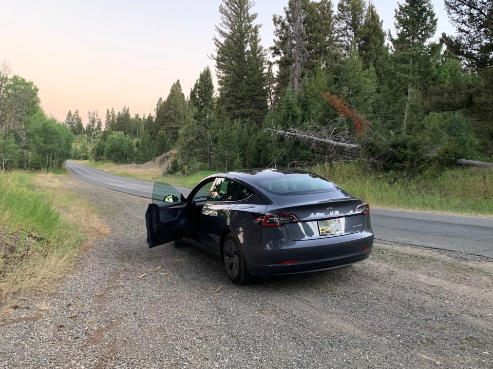 The Tesla Model 3 on a backroad in Montana