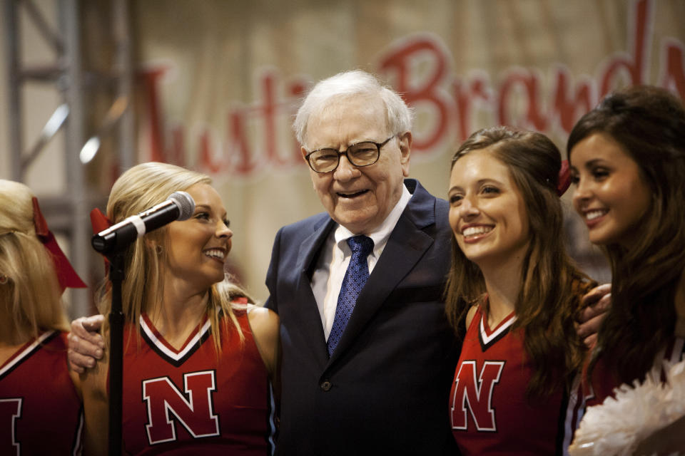 Warren Buffett sings with University of Nebraska cheerleaders during the Berkshire Hathaway Annual shareholders meeting in Omaha, May 5, 2012. Buffett assured shareholders of Berkshire Hathaway Inc that the company will be in good hands after he steps down, trying to allay fears about Berkshire's succession plan after revealing he had prostate cancer. REUTERS/Lane Hickenbottom (UNITED STATES - Tags: BUSINESS)