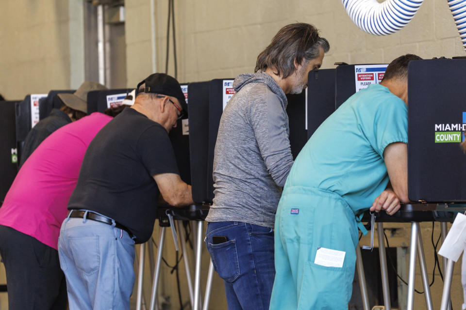 Voters casting their ballots during the midterm elections in Miami-Dade County at the Miami Beach Fire Department - Station 4 on Tuesday, Nov. 8, 2022 in Miami Beach, Fla. (David Santiago/Miami Herald via AP)