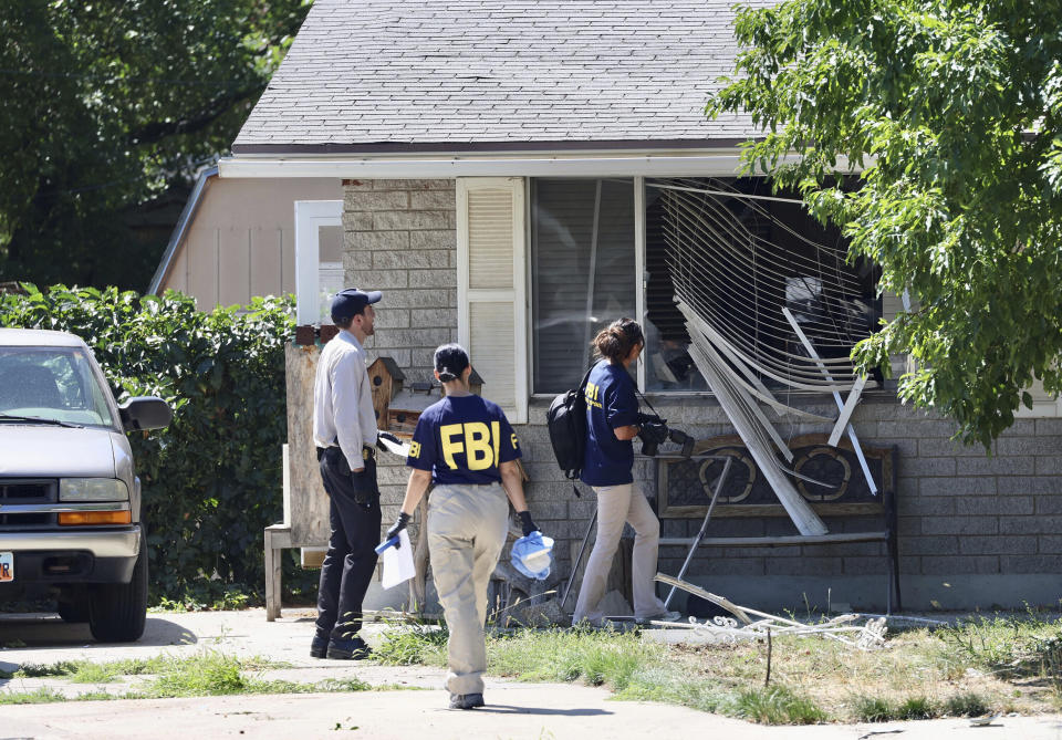 FILE - Law enforcement investigate the scene of a shooting involving the FBI, Aug. 9, 2023 in Provo, Utah. This week's confrontation that ended with FBI agents fatally shooting a 74-year-old Utah man who threatened to assassinate President Joe Biden was just the latest example of how violent rhetoric has created a more perilous political environment across the U.S. (Laura Seitz/The Deseret News via AP, File)