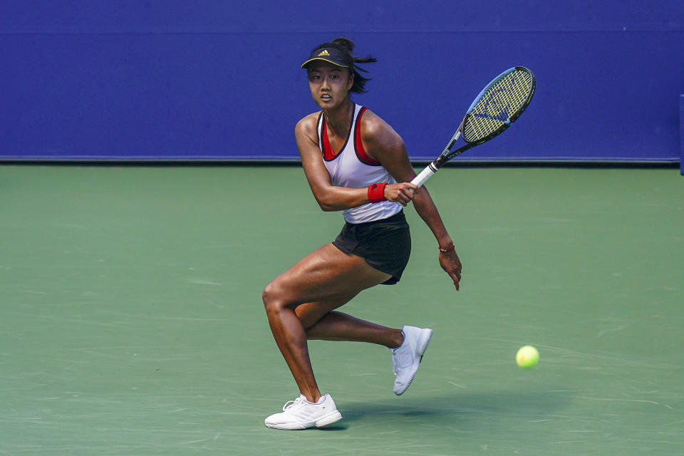 Ann Li, of the United States, returns a shot to Angelique Kerber, of Germany, during the third round of the US Open tennis championships, Friday, Sept. 4, 2020, in New York. (AP Photo/Seth Wenig)