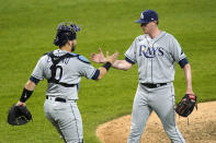 Tampa Bay Rays catcher Mike Zunino and relief pitcher Pete Fairbanks celebrate the team's 5-2 win over the Chicago White Sox after a baseball game Monday, June 14, 2021, in Chicago. (AP Photo/Charles Rex Arbogast)