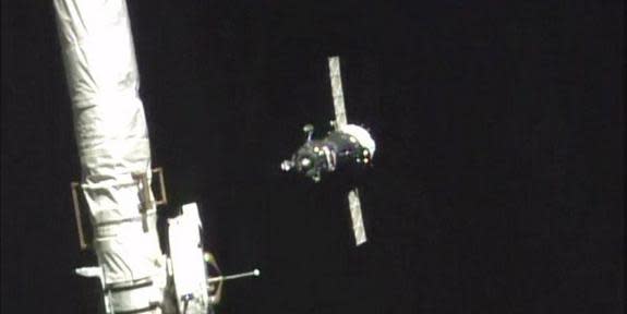 The Soyuz spacecraft carrying NASA astronaut Scott Kelly and Russian cosmonauts Mikhail Kornienko and Gennady Padalka is seen by a camera on the International Space Station during docking operations on March 27, 2015. Kelly and Kornienko are be