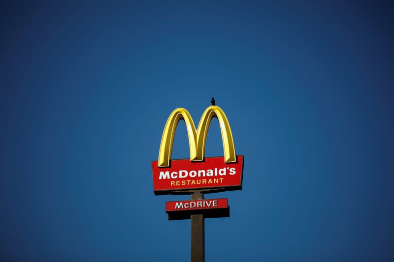 FILE PHOTO: The McDonald's company logo stands on a sign outside a restaurant in Bretigny-sur-Orge, near Paris