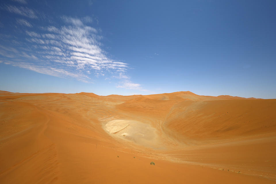 On top of Big Daddy dune at Sossusvlei in the Namib-Naukluft National Park of Namibia. The dune stands over 1,000 feet high, and it takes 45 minutes to climb its pitched angle route. (Photo: Gordon Donovan/Yahoo News)