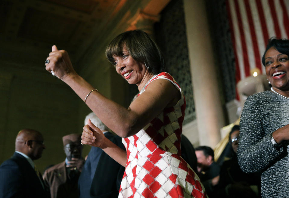 FILE - In this Dec. 6, 2016 file photo, Baltimore Mayor Catherine Pugh gives a thumbs-up to supporters after her inauguration ceremony inside the War Memorial Building in Baltimore. The disgraced former mayor of Baltimore was charged Wednesday, Nov. 20, 2019, with fraud and tax evasion involving sales of her self-published children's books. An 11-count federal indictment accuses Pugh of using her “Healthy Holly” children’s books to enrich herself, promote her political career and fund her run for mayor. (AP Photo/Patrick Semansky, File)