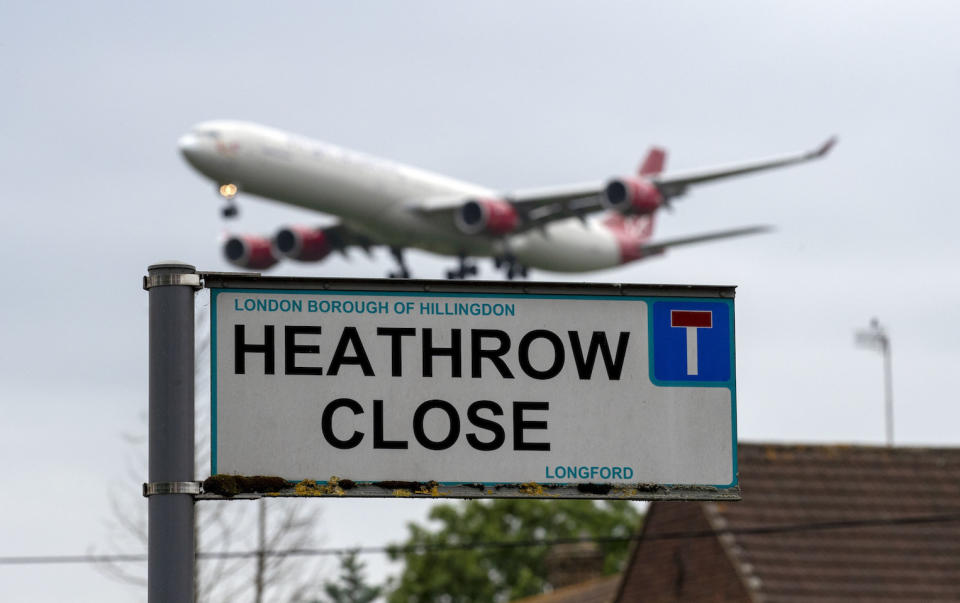 A plane landing at Heathrow Airport in west London viewed from the village of Longford (Picture: PA)