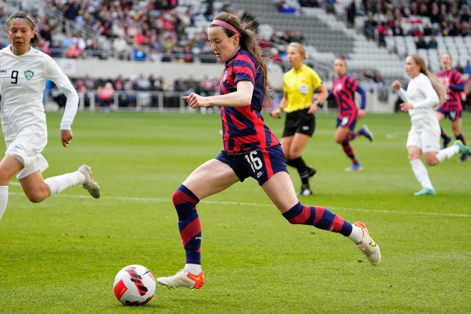 United States midfielder Rose Lavelle (16) dribbles the ball against Uzbekistan during the 1st half of their game at Lower.com Field in Columbus, Ohio on April 9, 2022. 