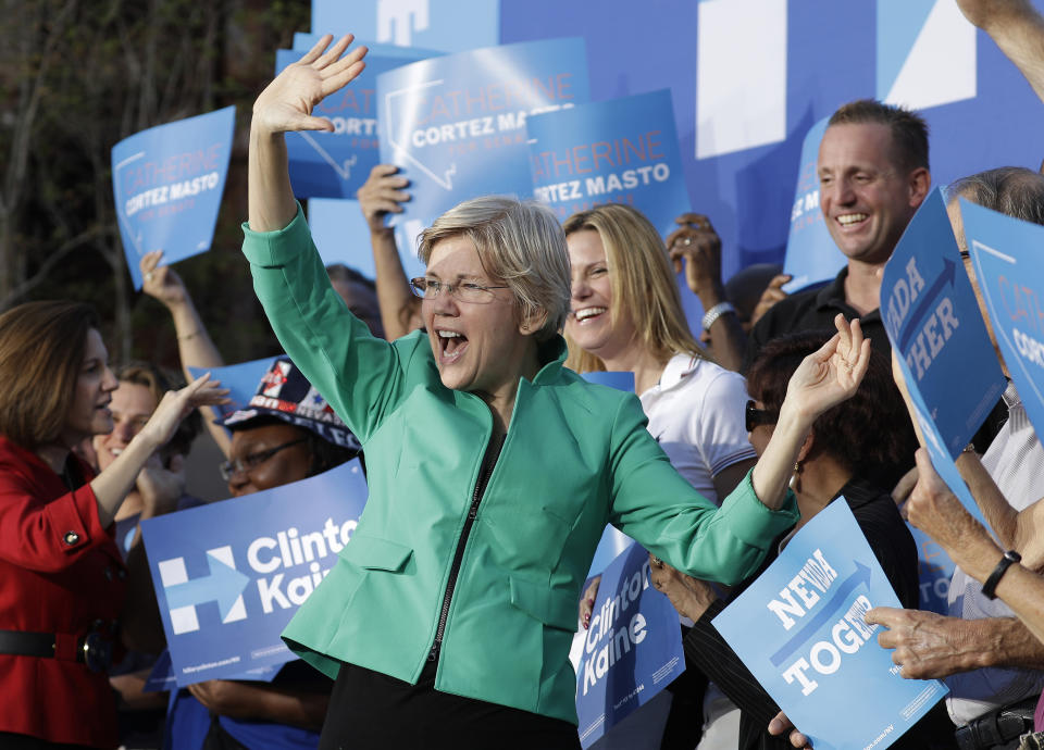 FILE - In this Oct. 4, 2016, file photo, Sen. Elizabeth Warren, D-Mass., attends a rally in Las Vegas. The rally was held to support Democratic presidential candidate Hillary Clinton. Warren, who made her name as a consumer advocate in the wake of the 2008 financial crisis, will make her first appearance Sunday, Feb. 17, 2019, as a presidential candidate in Las Vegas, the boom-and-bust town that made Nevada the epicenter of the country’s foreclosure crisis. (AP Photo/John Locher, File)