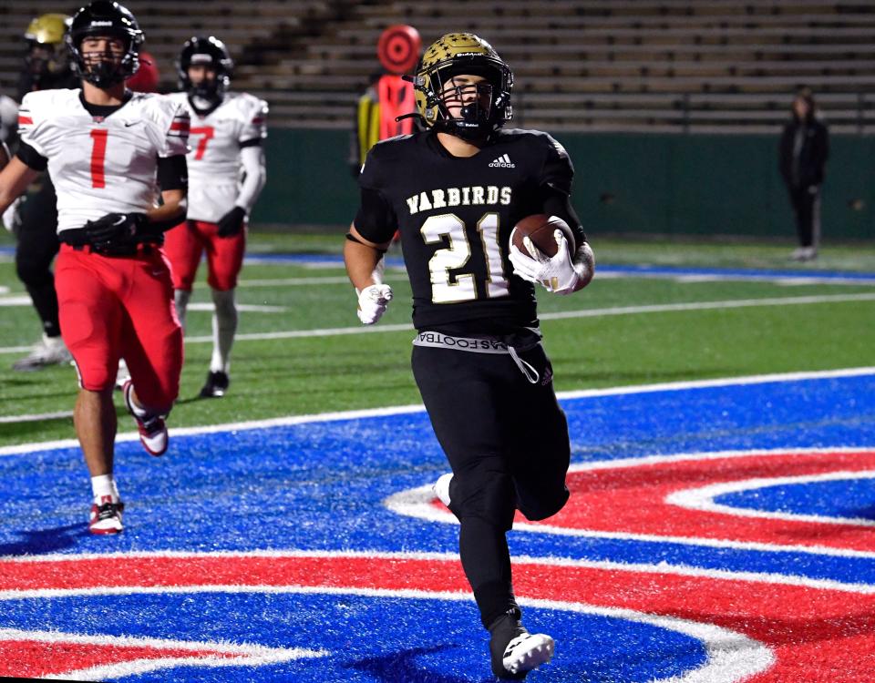 Abilene High running back Chad Lara runs for a touchdown against El Paso Hanks during Thursday’s 5A Div. I bi-district playoff game at Shotwell Stadium.
