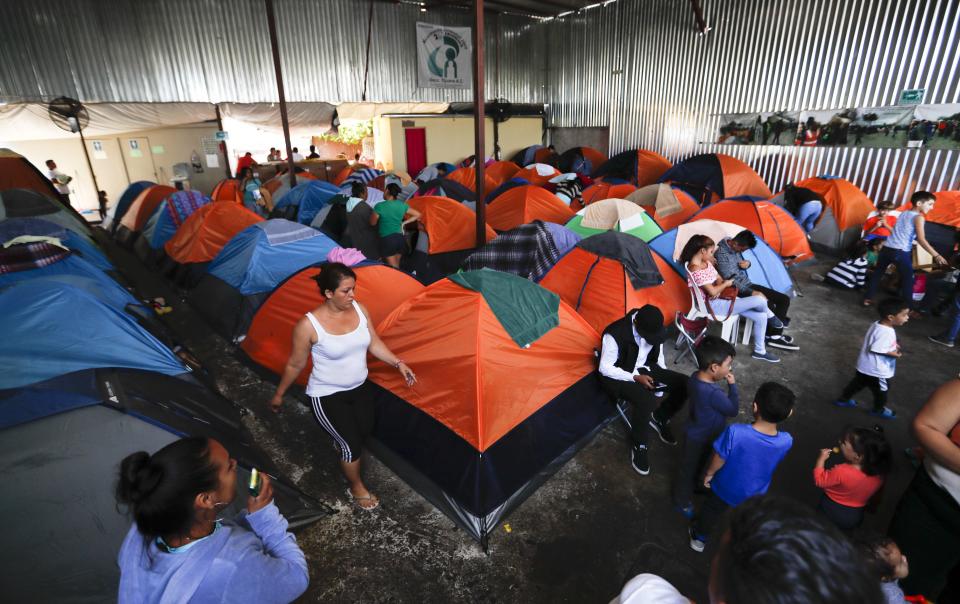 Tents fill a shelter used mostly by Mexican and Central American migrants who are applying for asylum in the U.S., on the border in Tijuana, Mexico, Sunday, June 9, 2019. The mechanism that allows the U.S. to send migrants seeking asylum back to Mexico to await resolution of their process has been running in Tijuana since January. (AP Photo/Eduardo Verdugo)