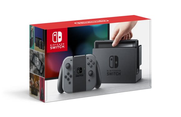 Nintendo Switch packaging depicting a hand lifting the Switch out of its dock.