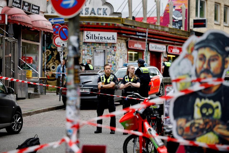 Police at the scene after a man was shot in the St Pauli district of Hamburg (REUTERS)