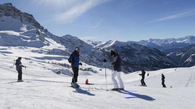 Cute girl skier skiing with family on mountain Stock Photo - Alamy