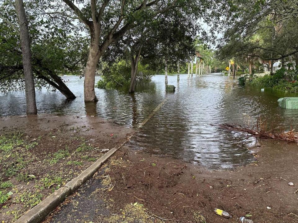 City of Bradenton workers closed parts of Virginia Drive along Wares Creek after Hurricane Idalia created flood waters making the road impassable on Wednesday, Aug. 30, 2023.