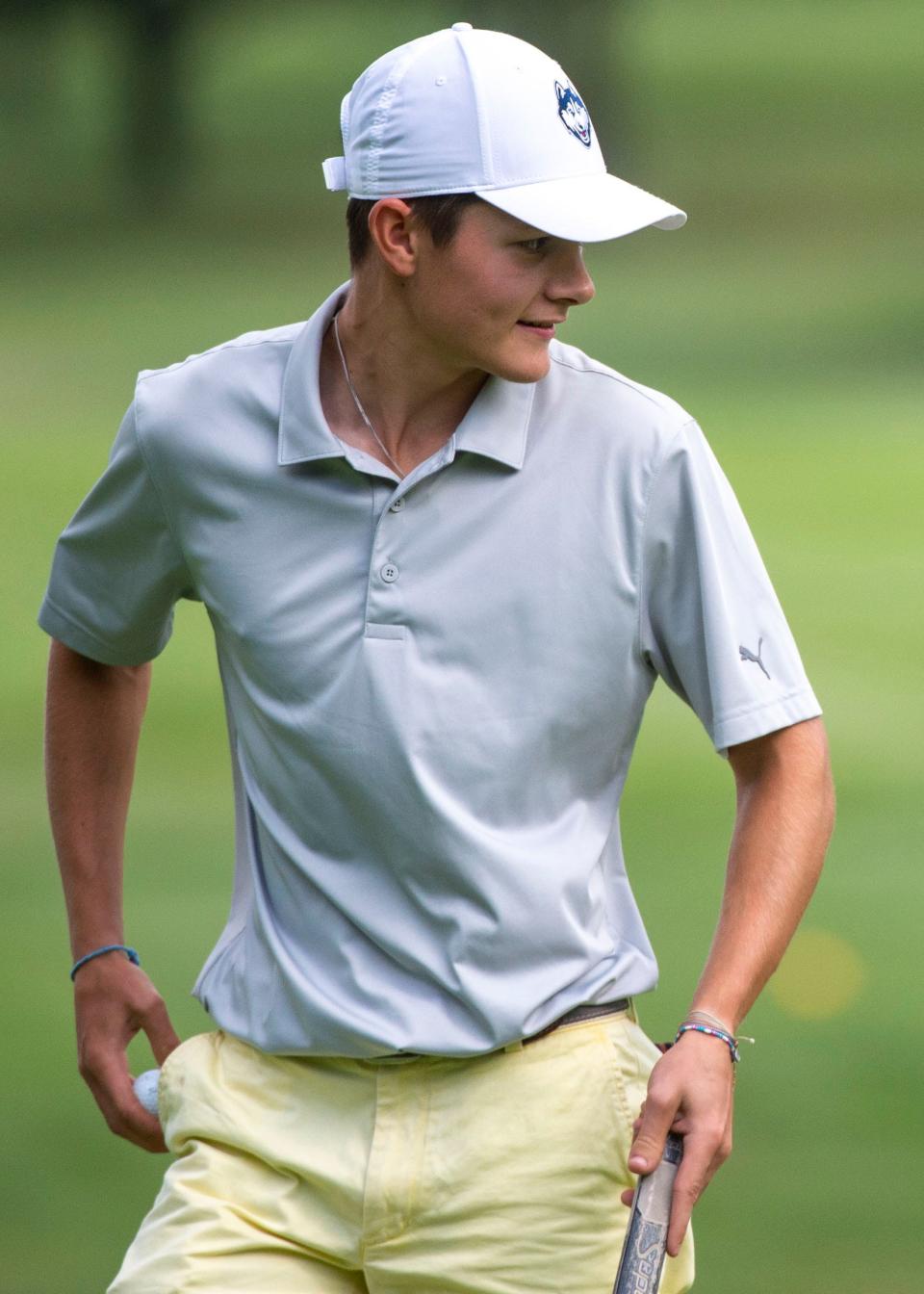 Northeastern's Caden Blanchette looks back at the hole after he birdied No. 12 for the seventh birdie of his round to win the YAIAA tournament at Briarwood Golf Club on Thursday, Sept. 28, 2023.