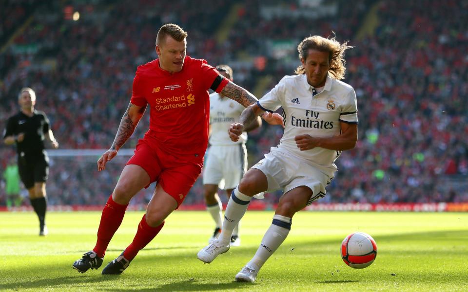 Liverpool's John Arne Riise (left) and Real Madrid's Michel Salgado battle for the ball during the charity match at Anfield,  - Credit: PA