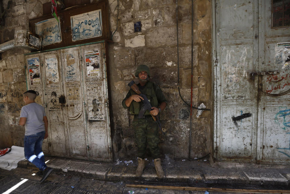 <p>Palestinian security forces in Nablus</p><p>A Palestinian security forces member stands guard during a raid after clashes with wanted Palestinians in the Old City of Nablus, Aug. 19, 2016. Two members of the Palestinian security forces and two armed Palestinian men were killed overnight when security forces attempted to arrest them. The Palestinian security forces have launched a concerted campaign to detain those Palestinians responsible for the shooting. (Photo: ALAA BADARNEH/EPA)</p>