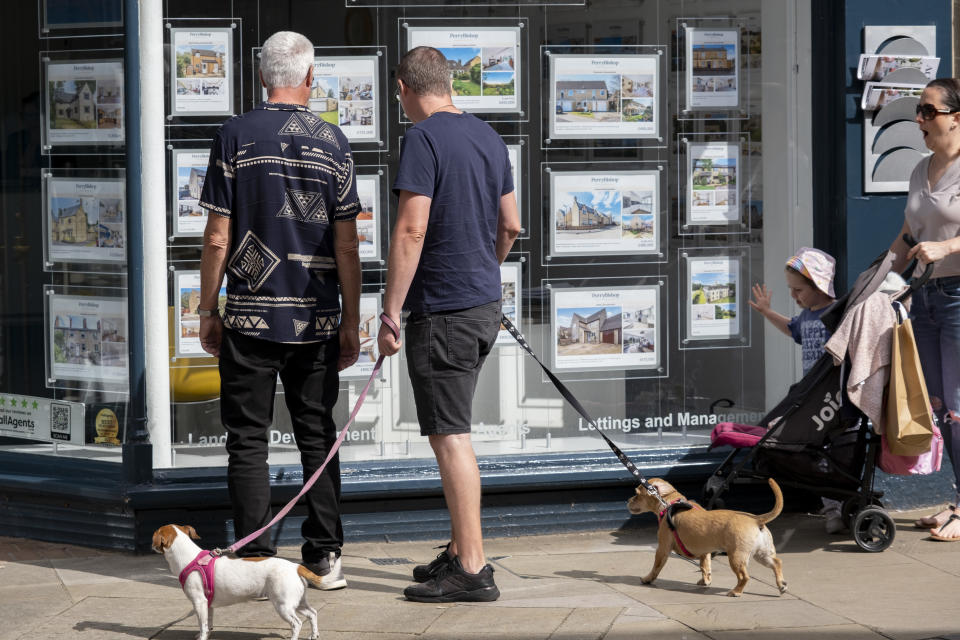 People looking at houses for sale in an estate agents window on 13th September 2023 in Cirencester, United Kingdom. Cirencester is known for having a large volume of real estate agents in it's small town centre as the rural housing market remains active. Cirencester is a market town in Gloucestershire. It is the eighth largest settlement in Gloucestershire and the largest town within the Cotswolds. Most of the buildings and homes in the town are made from the distinctive honey coloured Cotswold Stone. (photo by Mike Kemp/In Pictures via Getty Images)