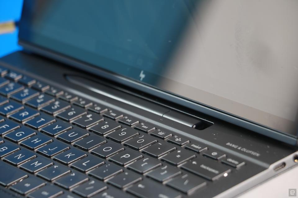 <p>HP Elite Folio Engadget review photo: A medium shot showing part of the device's keyboard and the stylus slot above it. A pen lies in the slot.</p>
