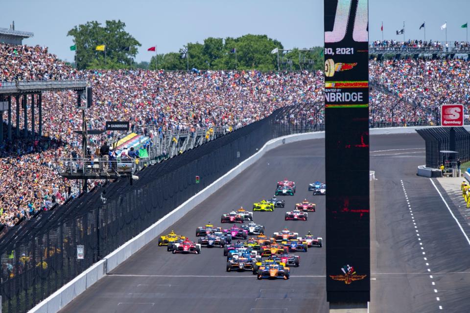 The field of 33 drivers takes the green flag in 2021 to start the 105th running of the Indy 500 at Indianapolis Motor Speedway.
 Doug McSchooler/For IndyStar
The field of 33 drivers take the green flag to start the race Sunday, May 30, 2021, during the 105th running of the Indianapolis 500 at Indianapolis Motor Speedway.