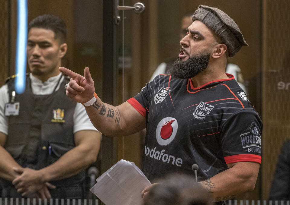 Ahad Nabi gestures as he reads a victim impact statement during the sentencing hearing for Australian Brenton Harrison Tarrant at the Christchurch High Court after Tarrant pleaded guilty to 51 counts of murder, 40 counts of attempted murder and one count of terrorism in Christchurch, New Zealand, Wednesday, Aug. 26, 2020. More than 60 survivors and family members will confront the New Zealand mosque gunman this week when he appears in court to be sentenced for his crimes in the worst atrocity in the nation's modern history. (John Kirk-Anderson/Pool Photo via AP)