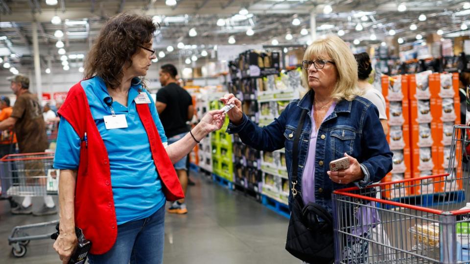 PHOTO: A staff speaks to a customer inside a Costco store on June 28, 2023 in Teterboro, New Jersey. (Kena Betancur/VIEWpress/Corbis via Getty Images)