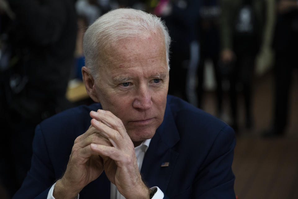 Former Vice President Joe Biden listens to voter in Los Angeles on Wednesday. The vice president is reportedly preparing a climate plan that he believes can appeal to blue-collar Trump voters. (ASSOCIATED PRESS/Jae C. Hong))